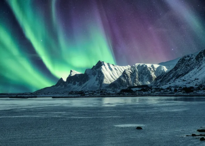 Aurora Borealis, Northern Lights Above of snowy mountain in Lofoten Islands