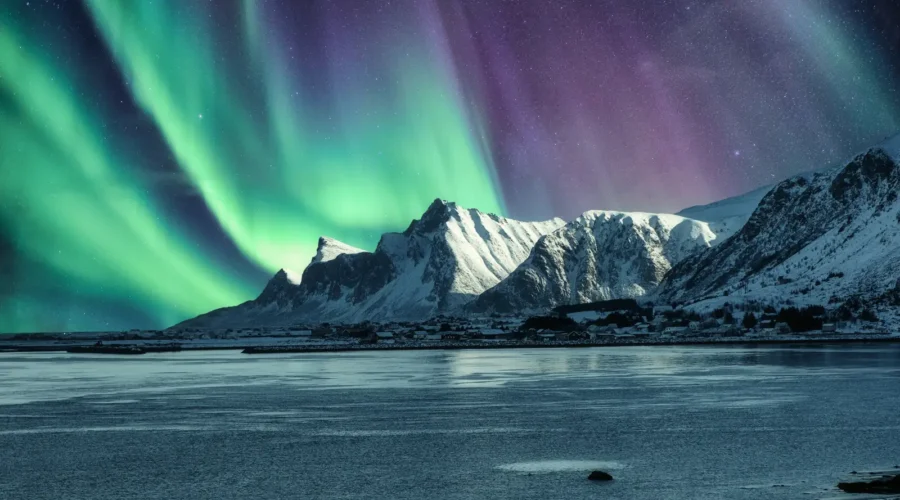 Aurora Borealis, Northern Lights Above of snowy mountain in Lofoten Islands